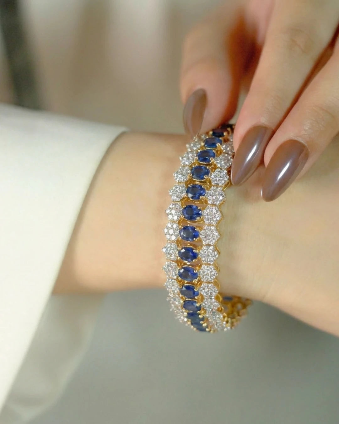 Royal Honeycomb Statement Bracelet by Jewel by JF featuring gold honeycomb design and intricate detailing.