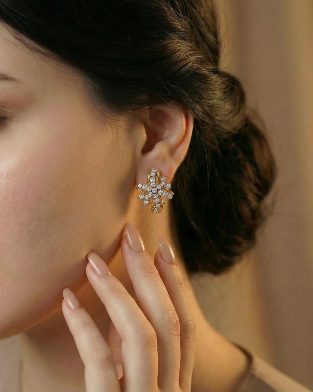 Twisted Ribbon Earrings by Jewel by JF featuring elegant, twisting ribbon design in gold with a polished finish.