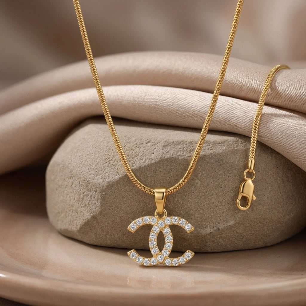 Silver Iconic Interlock Pendant Necklace by Jewel by JF featuring a stylish interwoven design on a delicate chain.