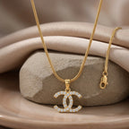 Silver Iconic Interlock Pendant Necklace by Jewel by JF featuring a stylish interwoven design on a delicate chain.