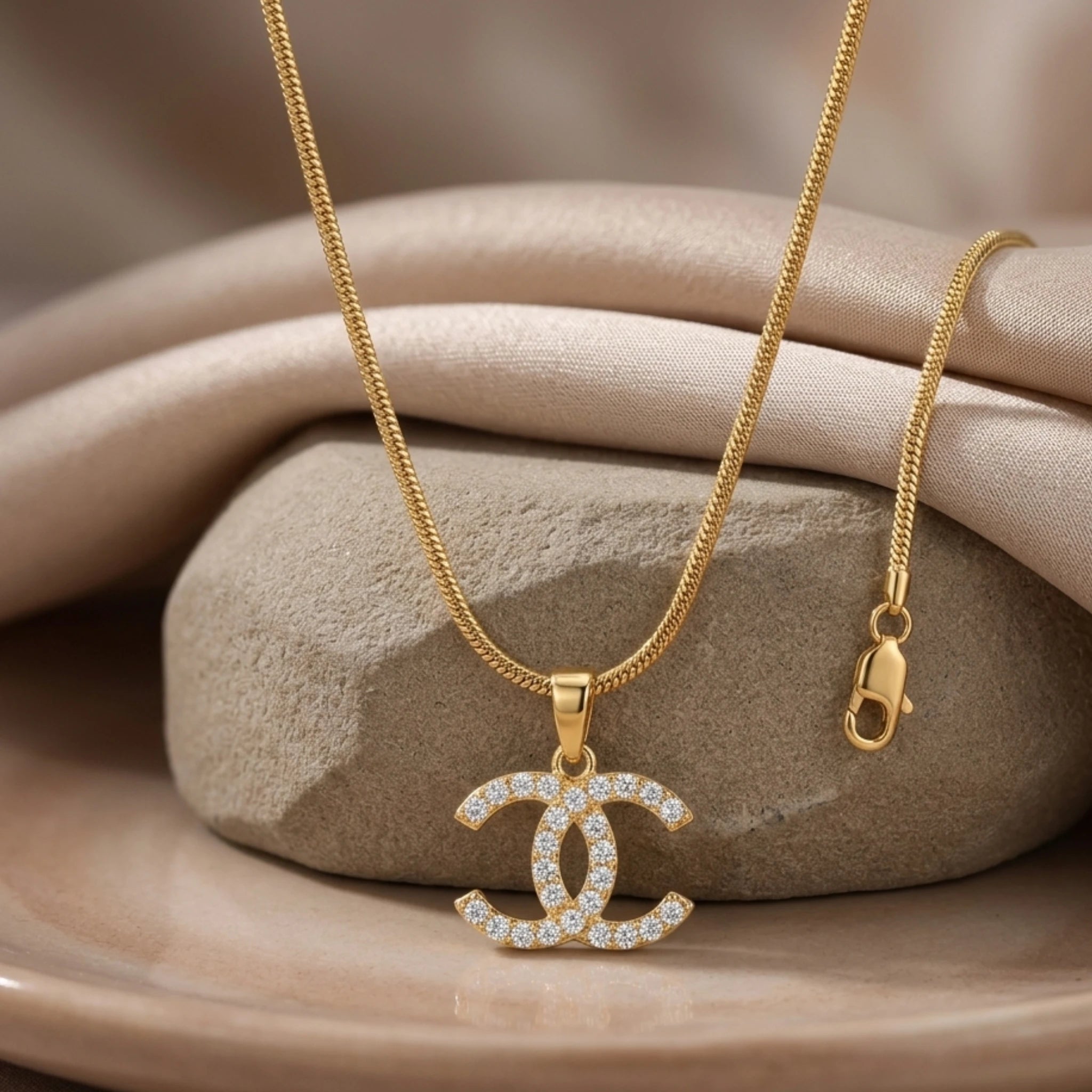 Silver Iconic Interlock Pendant Necklace by Jewel by JF featuring a stylish interwoven design on a delicate chain.