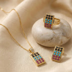 Jewelry set featuring mosaic-inspired designs from Jewel by JF's Mosaic Regal Heritage collection, including necklaces and earrings.