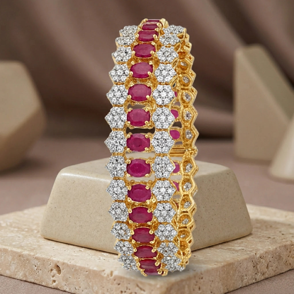 Jewel by JF Royal Honeycomb statement bracelet featuring gold honeycomb design and bold, intricate metalwork.