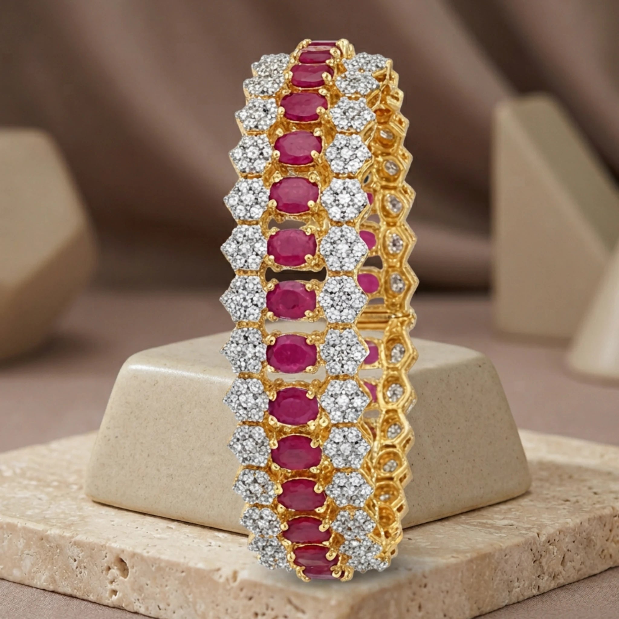 Jewel by JF Royal Honeycomb statement bracelet featuring gold honeycomb design and bold, intricate metalwork.