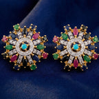 Starburst earrings by Jewel by JF featuring a radiant, star-shaped design with sparkling accents in gold and silver tones.